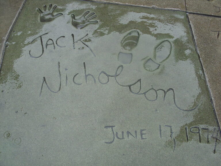 How did the practice of movie stars’ placing their footprints in front of Grauman’s Chinese Theatre begin?