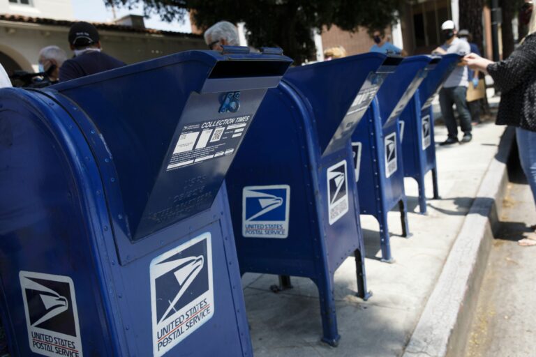 How much mail is handled by the U.S. Post Office per day?