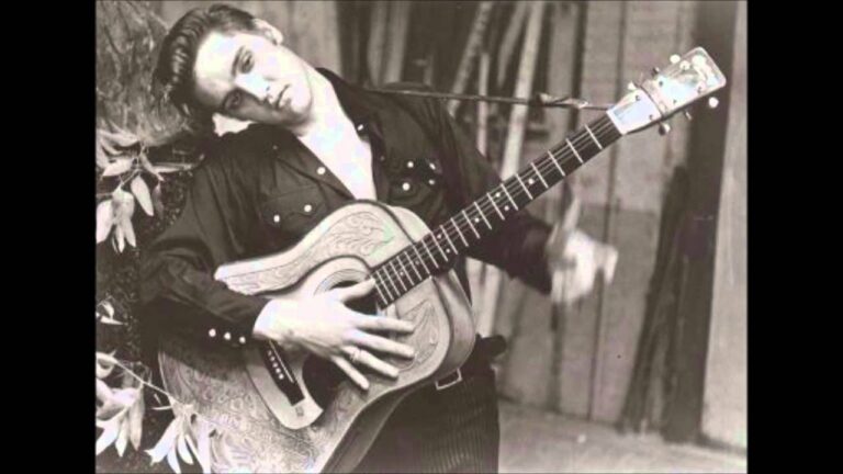 What was Elvis Presley’s first number one hit?