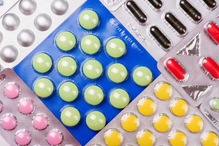 What was the name of the first commercially available oral contraceptive pill?
