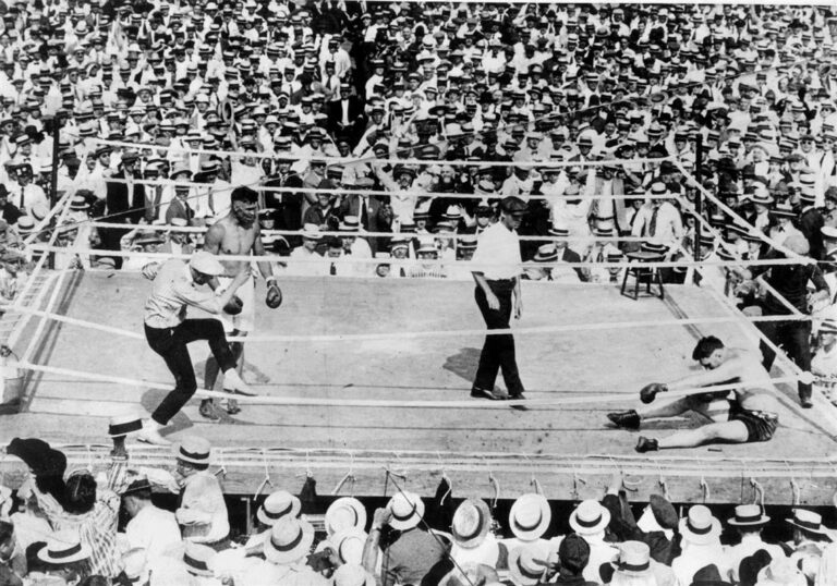 When did Jack Dempsey go through the ropes in a boxing match?