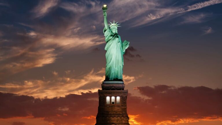 When was the Emma Lazarus poem “The New Colossus” added to the Statue of Liberty?