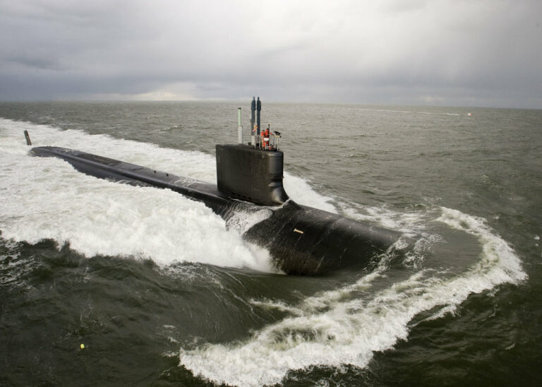 When was the first atomic-powered submarine launched?